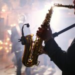 man-plays-on-a-saxophone-scaled.jpg