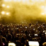 rear-view-excited-fans-having-fun-music-festival-taking-pictures-stage-with-their-smart-phones-copy-space-scaled.jpg