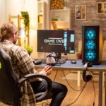 man-his-powerful-pc-computer-living-room-late-night-loosing-game_482257-22748