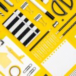 flat-lay-office-stationery-with-notepad-different-pencils_23-2148524807